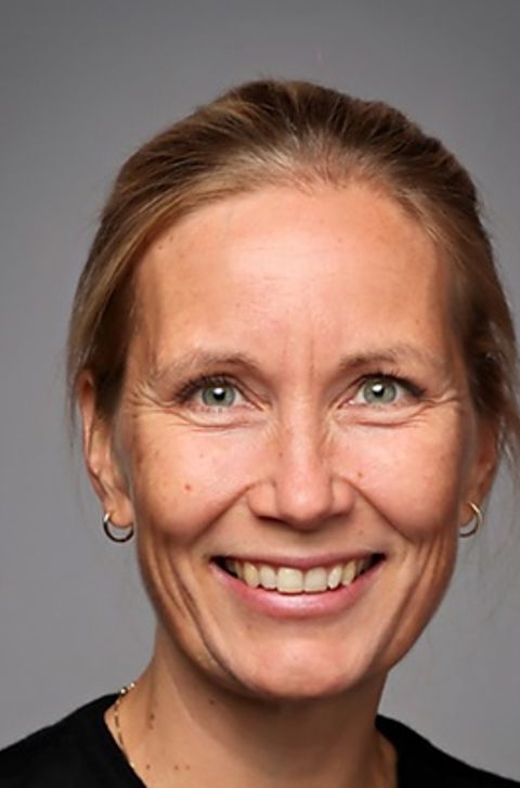 Et nærbilde av en person som smiler Et nærbilde av en person som smiler